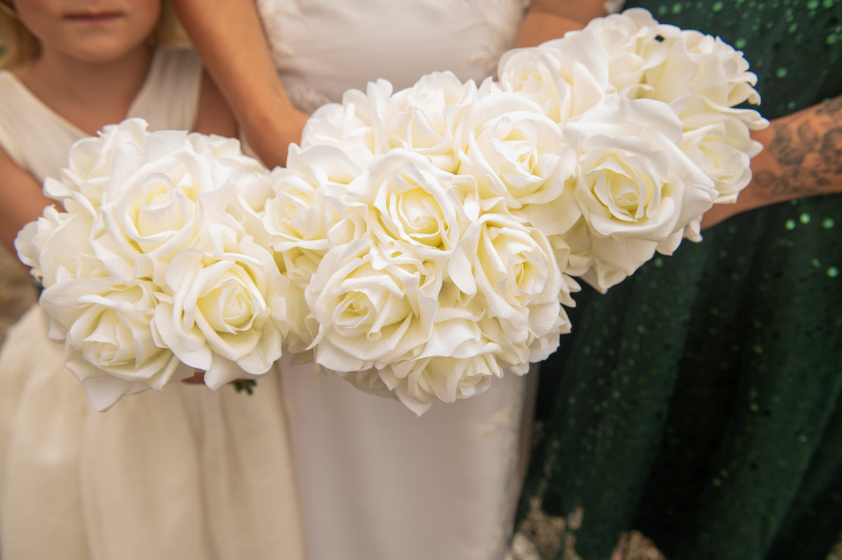 Bridesmaid bouquets of white roses